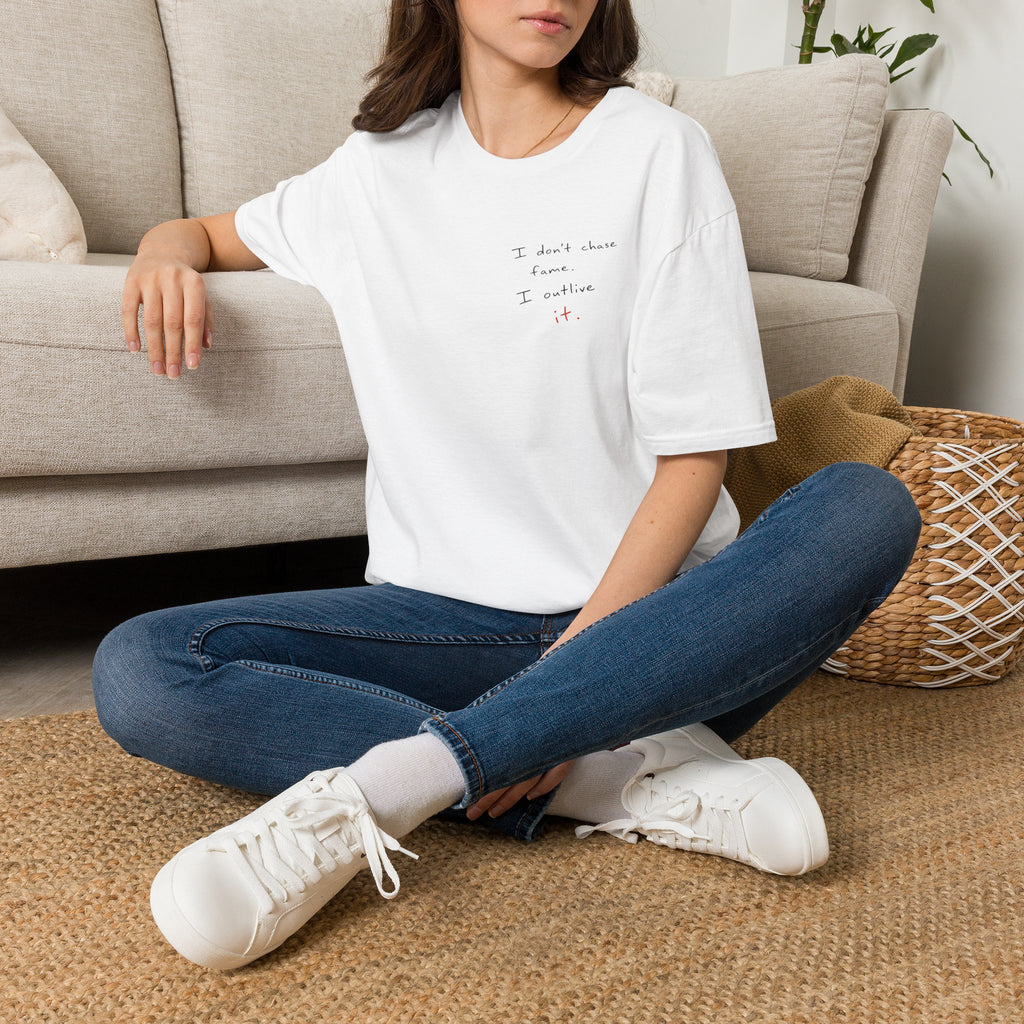 Minimalist White T‑Shirt - "I don't chase fame I cultivate it." Small Script Chest Print